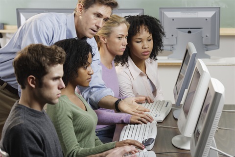 teacher helping with pc