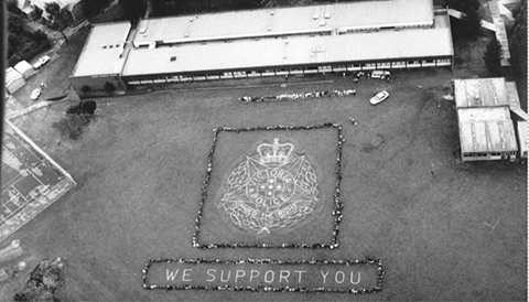 aerial photo of syndal technical college with a tribute to police on the oval after the walsh street shootings