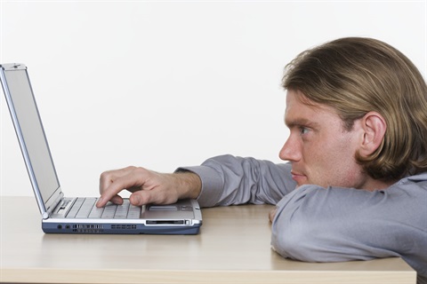 Man using laptop for printing