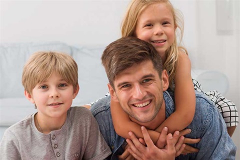 Man Posing with Children