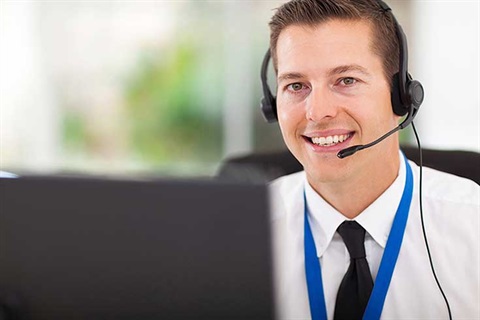 Man wearing headphones at help desk