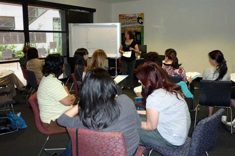 Adults attending a parenting program session