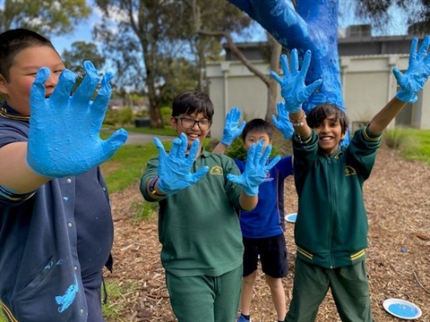 MYzone students place handprints on Blue Tree