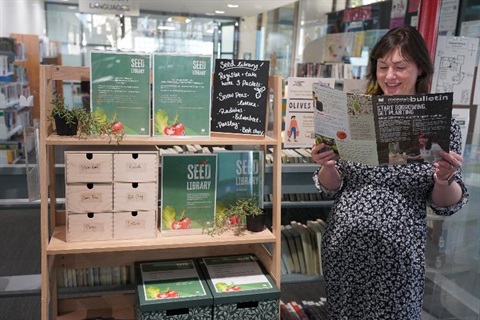 reading bulletin next to seed library at Glen Waverley Library
