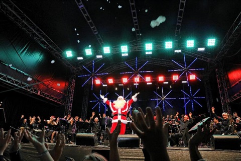 Santa Claus sings at Monash Carols by Candlelight