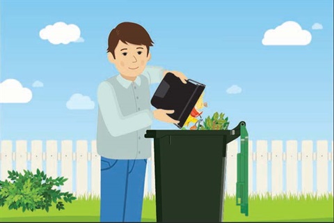 Putting scraps in a food waste collection bin